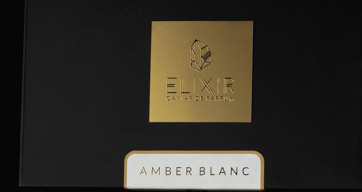Open tin of Amber Blanc Caviar Bakhoor with bone white lid