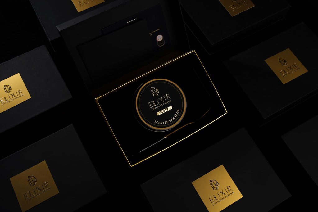 The Noir box open, from above, among its closed boxes