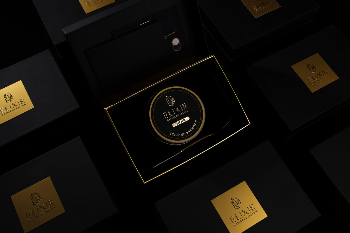The Noir box open, from above, among its closed boxes