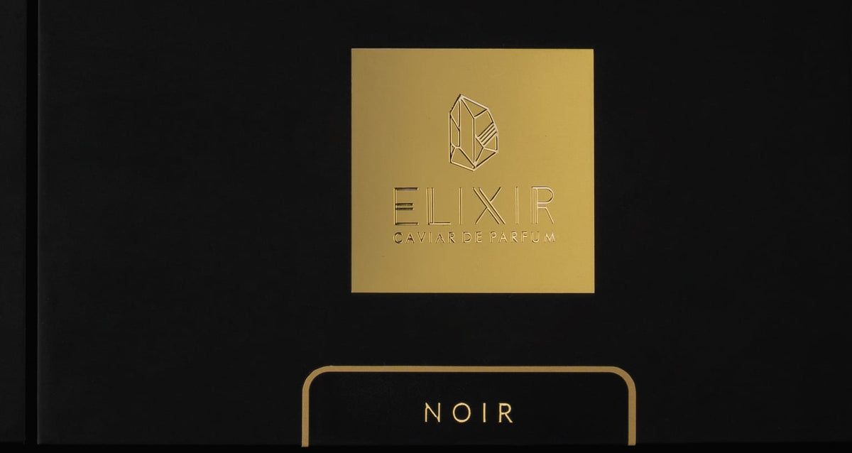 Open tin of Noir Caviar Bakhoor, black pearls flecked with gold